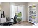 Well-lit home office with backyard views and modern furnishings at 1497 Maple Ridge Ct, Columbus, IN 47201