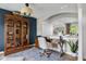 Bright office with large wooden bookcase and elegant desk, offering a comfortable workspace at 1497 Maple Ridge Ct, Columbus, IN 47201