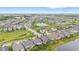 Aerial view showcasing the houses in the community with a pond and green common space for everyone to enjoy at 1505 Avondale Dr, Westfield, IN 46074