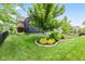 Well-maintained backyard with garden beds featuring vibrant plants at 1505 Avondale Dr, Westfield, IN 46074