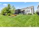 Manicured backyard with lush green lawn, and professional landscaping at 1505 Avondale Dr, Westfield, IN 46074