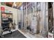 Unfinished basement featuring mechanicals with plastic-curtain divide and ample storage space on the shelf at 1505 Avondale Dr, Westfield, IN 46074