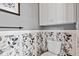 Powder room featuring stylish wallpaper and a modern wall-mounted cabinet at 1505 Avondale Dr, Westfield, IN 46074