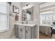 Bathroom with vanity, framed mirror, and a view into the main bedroom at 1505 Avondale Dr, Westfield, IN 46074