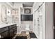 Well-lit bathroom with a glass-enclosed shower and dark wood vanity and fixtures at 1505 Avondale Dr, Westfield, IN 46074