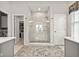 Elegant bathroom featuring a walk-in shower with custom tile and neutral walls at 1505 Avondale Dr, Westfield, IN 46074