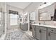 Bright bathroom featuring double vanities, a walk-in shower, and stylish decor at 1505 Avondale Dr, Westfield, IN 46074