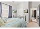 Cozy bedroom with soft blue accents, closet, and an adjoining room at 1505 Avondale Dr, Westfield, IN 46074
