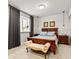 Cozy bedroom with a wooden bed frame, neutral walls and decor, and a window at 1505 Avondale Dr, Westfield, IN 46074
