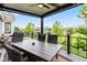 Beautiful covered deck area with seating and view of pond and green spaces at 1505 Avondale Dr, Westfield, IN 46074