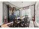 Elegant dining room with a chandelier, black hutch, and a black floral rug at 1505 Avondale Dr, Westfield, IN 46074