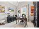 Home office featuring vaulted ceiling, natural light, and built-in shelves at 1505 Avondale Dr, Westfield, IN 46074