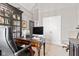 Office space with a view of the double doors and built-in shelving at 1505 Avondale Dr, Westfield, IN 46074