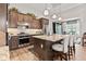 Kitchen features include a large island, stainless appliances, modern lighting, and sleek cabinetry at 1505 Avondale Dr, Westfield, IN 46074