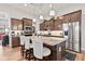Well-equipped kitchen with stainless steel appliances, a central island, and modern pendant lights at 1505 Avondale Dr, Westfield, IN 46074
