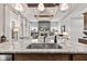 Spacious kitchen features granite countertops, stainless steel appliances, and stylish pendant lighting at 1505 Avondale Dr, Westfield, IN 46074