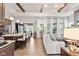 Open concept living area flows from kitchen to sofa featuring hardwood floors and an abundance of natural light at 1505 Avondale Dr, Westfield, IN 46074