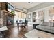 Bright living room featuring a fireplace, large windows, and comfortable seating at 1505 Avondale Dr, Westfield, IN 46074