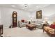 Cozy living room featuring a grandfather clock, gray couches, and neutral carpeting at 1505 Avondale Dr, Westfield, IN 46074