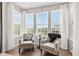 Bright sitting area with large windows and comfortable armchairs for relaxation and enjoyment at 1505 Avondale Dr, Westfield, IN 46074