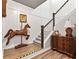 Beautiful staircase featuring a decorative wooden horse and a classic chest of drawers at 1505 Avondale Dr, Westfield, IN 46074