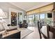 Bright sunroom featuring sliding glass doors, a lake view, and comfortable seating at 1505 Avondale Dr, Westfield, IN 46074