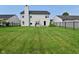 Spacious backyard featuring a well-manicured lawn and dark metal fencing at 15524 Follow Dr, Noblesville, IN 46060
