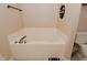 Relaxing bathtub with a tiled surround and updated faucet and shower fixture at 15524 Follow Dr, Noblesville, IN 46060