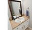 Cozy half bathroom featuring a single sink vanity with neutral countertop and framed mirror at 15524 Follow Dr, Noblesville, IN 46060