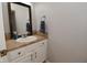 Cozy half bathroom featuring a single sink vanity with neutral countertop and framed mirror at 15524 Follow Dr, Noblesville, IN 46060