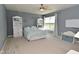 This bedroom has large windows for great natural light and two built-in bookshelves for storage at 15524 Follow Dr, Noblesville, IN 46060