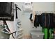 Walk-in closet with clothes, storage containers, and lots of shelving at 15524 Follow Dr, Noblesville, IN 46060