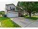Charming two-story home featuring an attached garage, complemented by a well-maintained lawn and mature trees at 15524 Follow Dr, Noblesville, IN 46060
