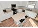 Bright kitchen featuring white cabinets, stainless steel appliances, and a center island with seating at 15524 Follow Dr, Noblesville, IN 46060