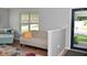 Cozy living room features a neutral-toned sofa with vibrant throw pillows near the entrance at 15524 Follow Dr, Noblesville, IN 46060