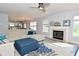 Bright living room featuring a fireplace, plush sofa, stylish rug, and plenty of natural light at 15524 Follow Dr, Noblesville, IN 46060
