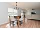 View of dining area leading to living room with fireplace and comfortable seating at 15524 Follow Dr, Noblesville, IN 46060