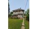 The backyard features a lawn and a covered porch at 1617 Blaine Ave, Terre Haute, IN 47804
