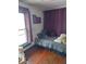 A cozy bedroom features a bright window and a comfortable bed with plush pillows at 1617 Blaine Ave, Terre Haute, IN 47804