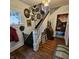A charming entryway with hardwood floors, a staircase, and decorative touches at 1617 Blaine Ave, Terre Haute, IN 47804