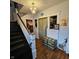 Entryway boasting a staircase, chandelier and refinished hardwood floors throughout the home at 1617 Blaine Ave, Terre Haute, IN 47804