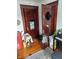 Shows some items on a table and a keyboard in a room with two dark wood doors at 1617 Blaine Ave, Terre Haute, IN 47804