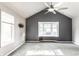 Vaulted bedroom with large window bay and ceiling fan at 1663 Cloister Dr, Indianapolis, IN 46260