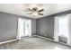 Gray bedroom showcasing windows and a ceiling fan at 1663 Cloister Dr, Indianapolis, IN 46260