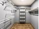 Walk-in closet with custom shelving for optimal storage at 1663 Cloister Dr, Indianapolis, IN 46260