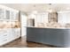 Modern kitchen with white cabinets, stainless steel appliances, and stylish countertops at 1663 Cloister Dr, Indianapolis, IN 46260