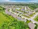 Aerial view of a neighborhood featuring single Gathering homes, streets, and a pond at 1739 Wedgewood Pl, Avon, IN 46123