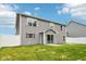 Backyard view featuring the house, white fence, sliding door, and grassy yard at 1739 Wedgewood Pl, Avon, IN 46123
