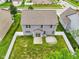 Aerial view of a home with a fenced backyard, patio area, and well-maintained lawn at 1739 Wedgewood Pl, Avon, IN 46123