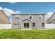 Backyard featuring green lawn, a sliding glass door, and a white privacy fence at 1739 Wedgewood Pl, Avon, IN 46123